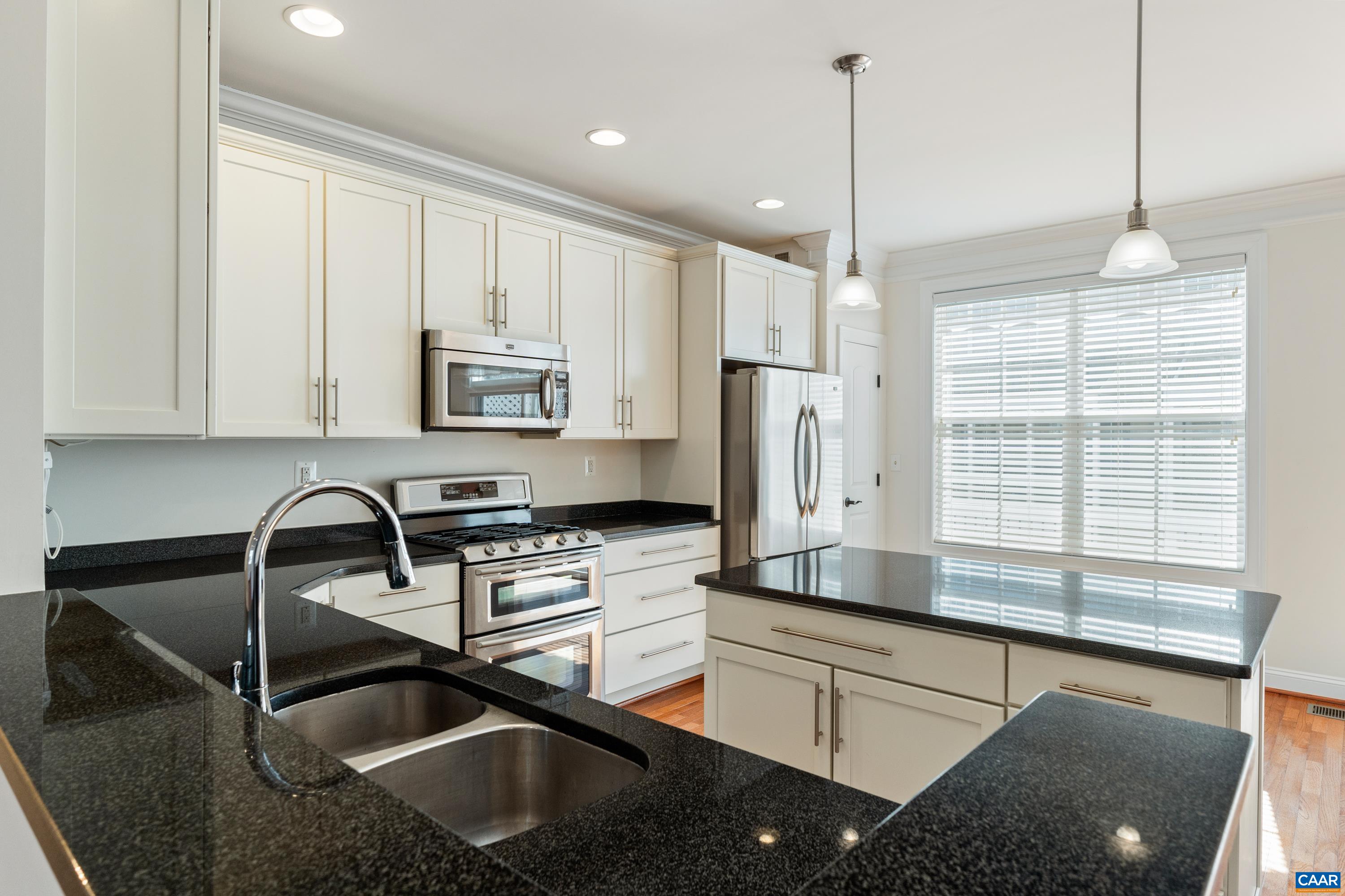 408 Samara Court Charlottesville, VA 22903 - Photo 18 of 44 a kitchen that has a sink cabinets and window