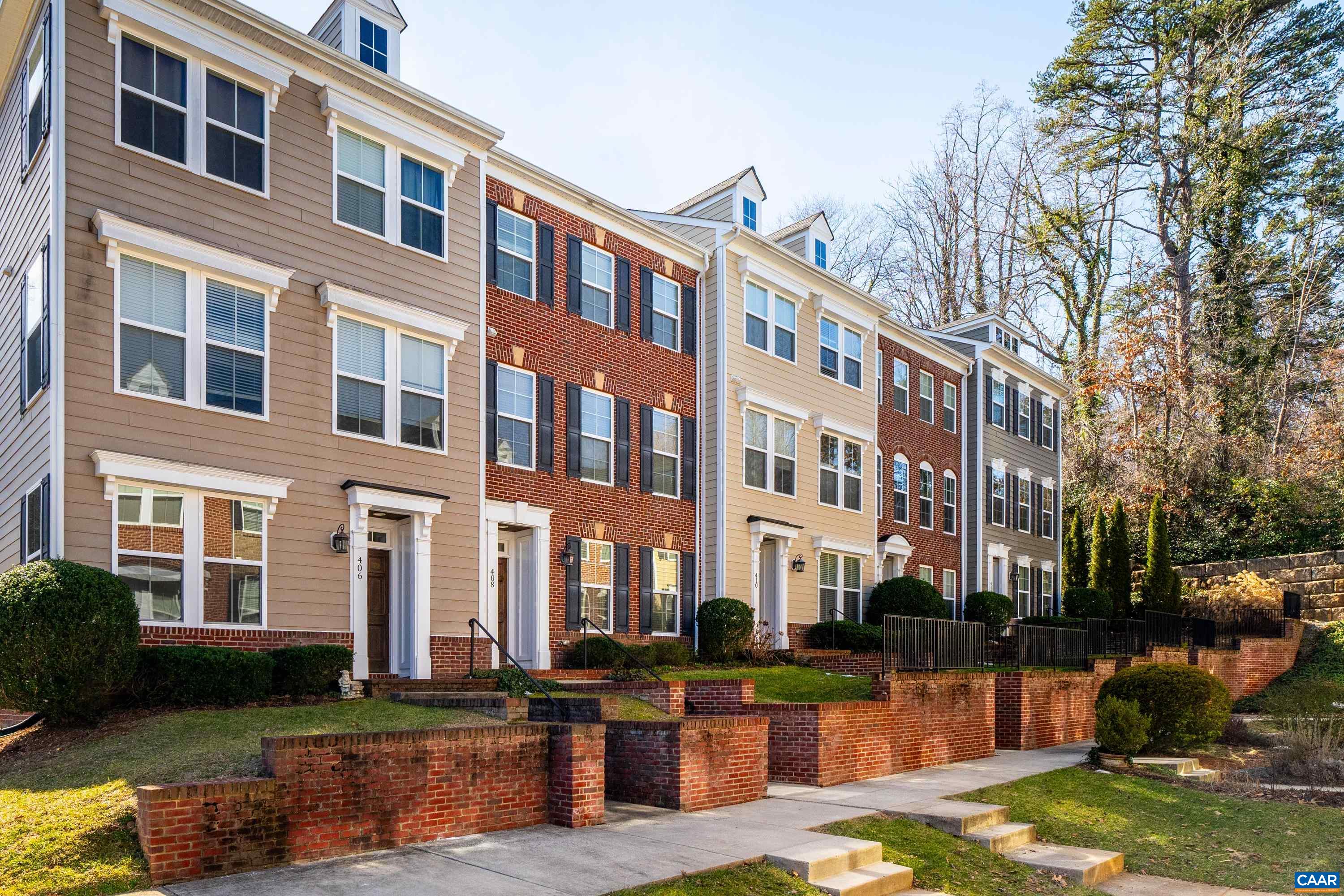 408 Samara Court Charlottesville, VA 22903 - Photo 3 of 44 a front view of a building with lake view and trees around