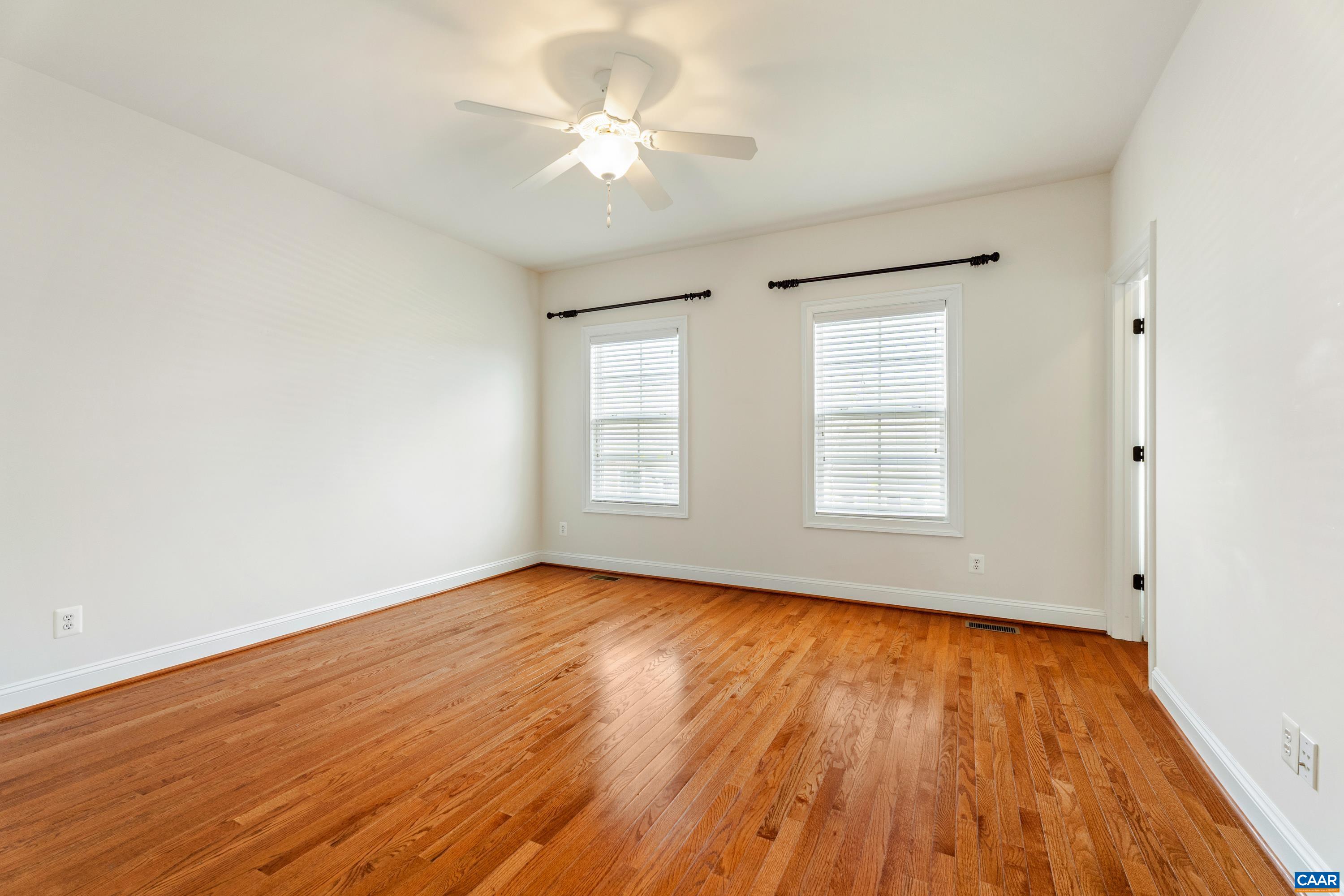 408 Samara Court Charlottesville, VA 22903 - Photo 34 of 44 an empty room with wooden floor and windows