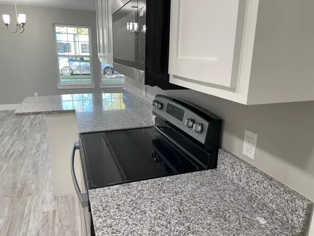 a view of a hallway with windows