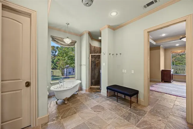 a living room with a couch and a wooden floor