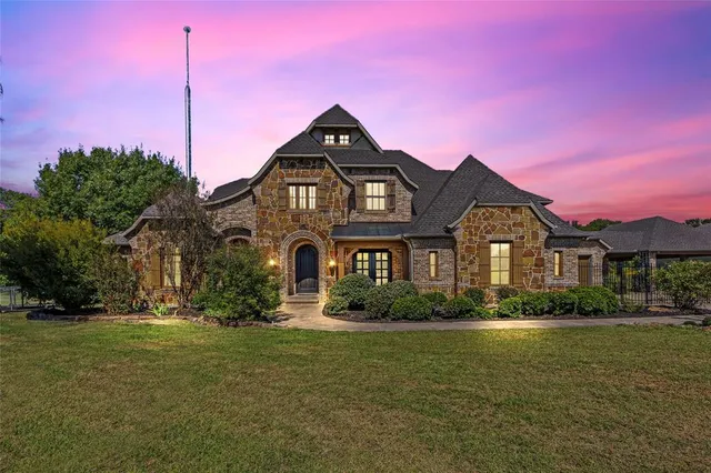 a front view of a house with swimming pool having outdoor seating