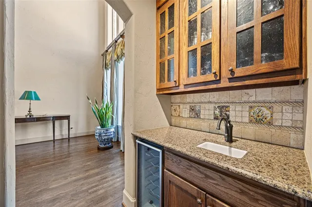 a kitchen with a sink and a potted plant