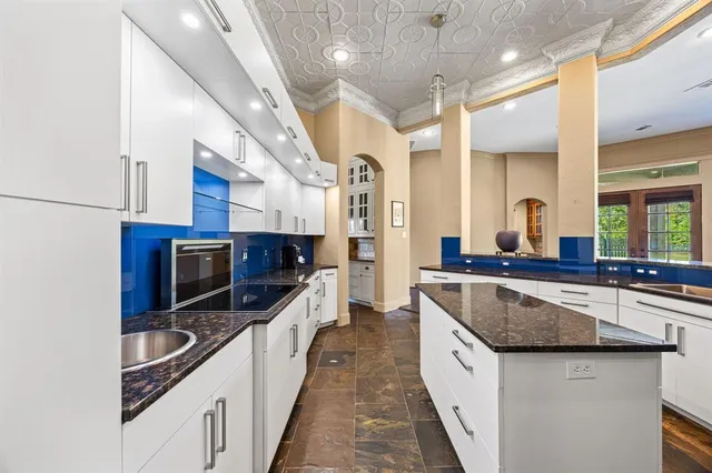a large kitchen with stainless steel appliances