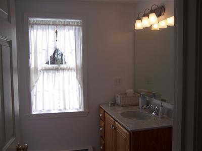 78 Richardson Road Centerville, MA 02632 - Photo 18 of 20 a bathroom with a sink toilet and window