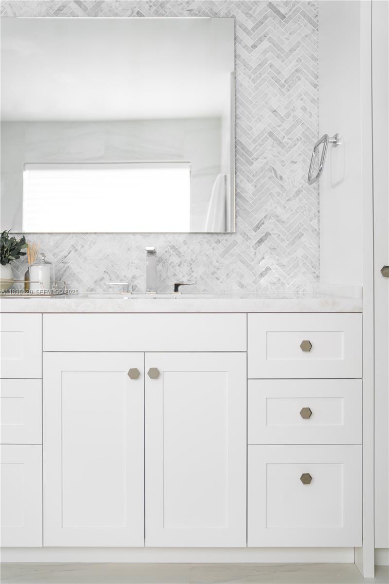 12855 Maple Road North Miami, FL 33181 - Photo 29 of 51 a bathroom with a sink and a mirror