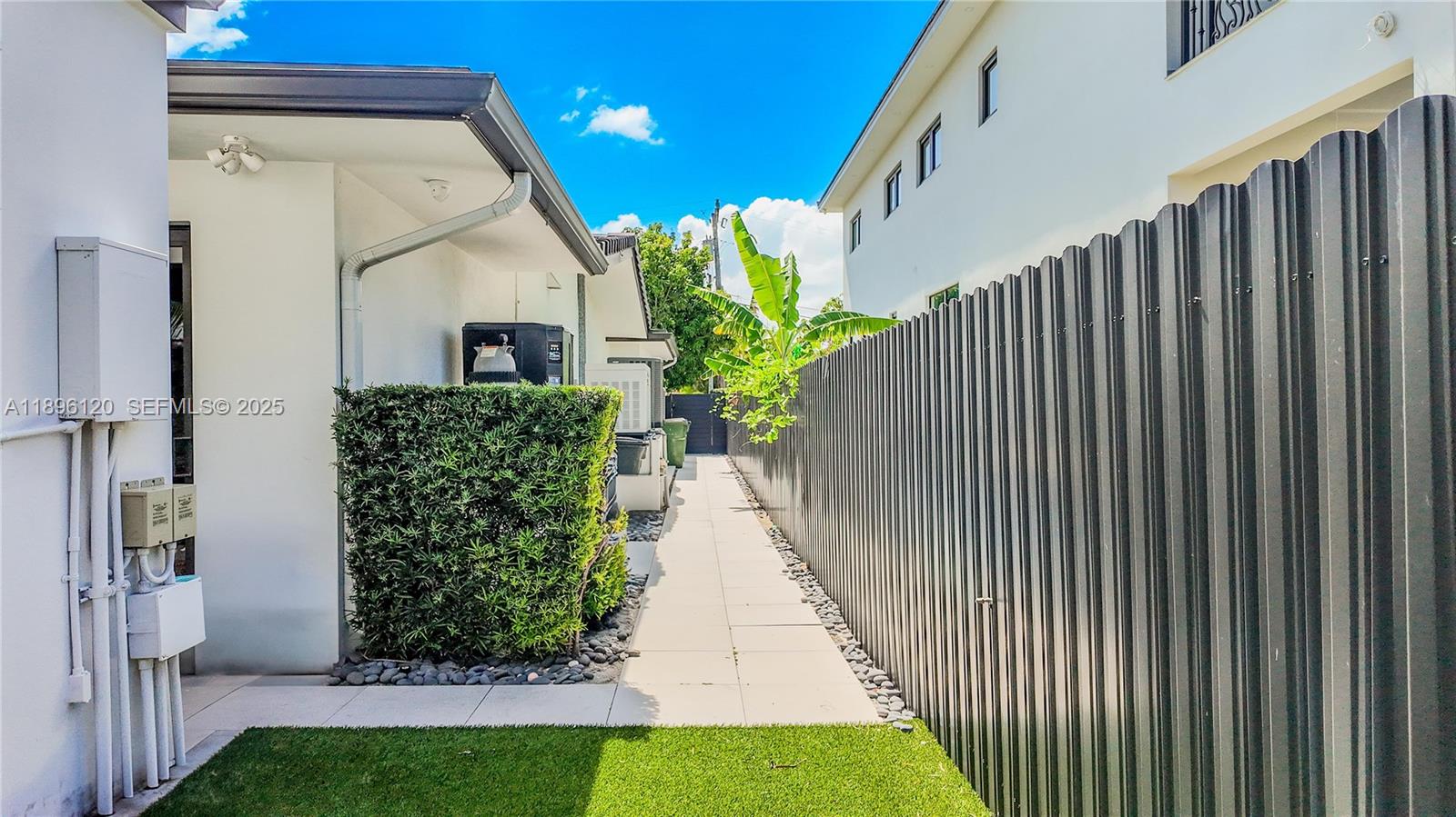12855 Maple Road North Miami, FL 33181 - Photo 48 of 51 a view of a back yard of the house