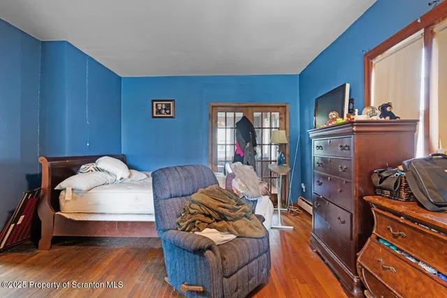 a bedroom with furniture and a window