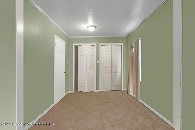 a view of hallway with livingroom