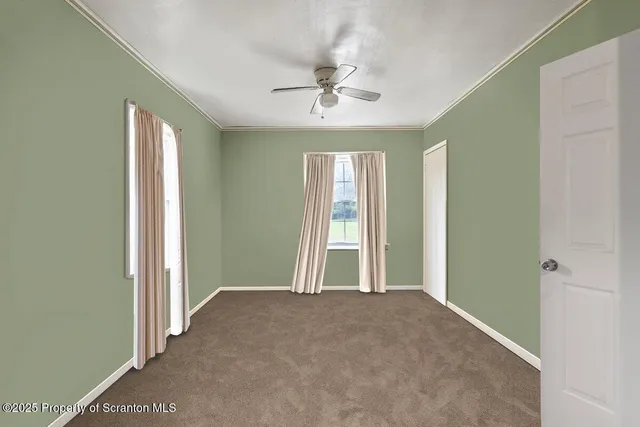 wooden floor and window in an empty room