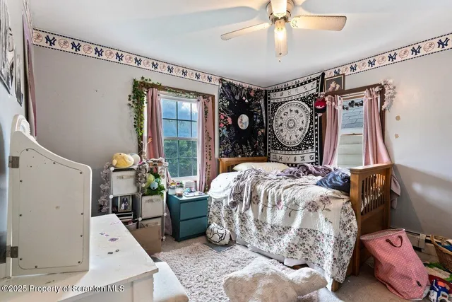 a bed room with a bed and a large mirror