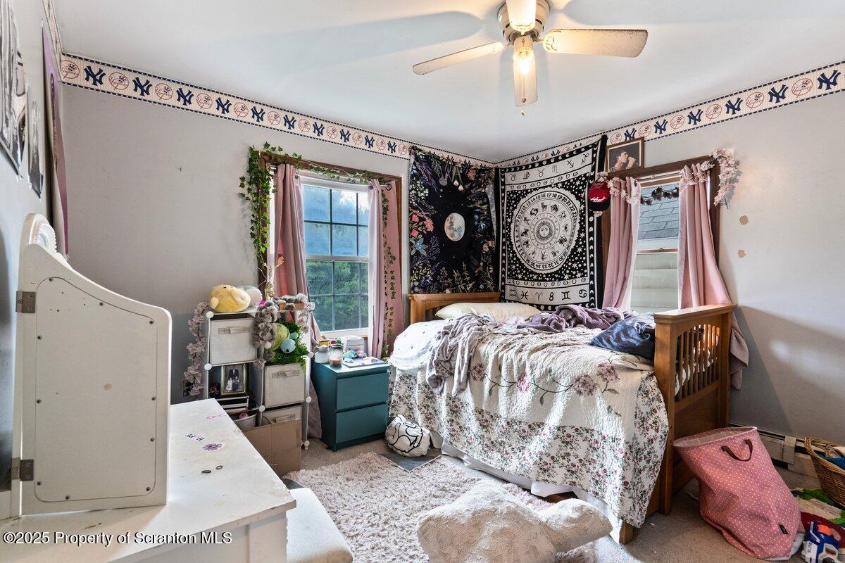 1411 Watson Street Scranton, PA 18504 - Photo 24 of 38 a bed room with a bed and a large mirror