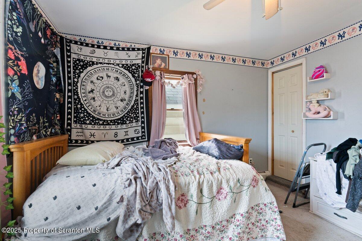 1411 Watson Street Scranton, PA 18504 - Photo 26 of 38 a bedroom with bed and a mirror