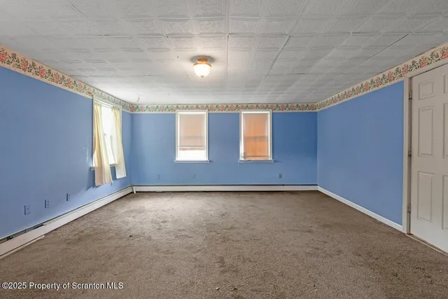 a view of an empty room with window