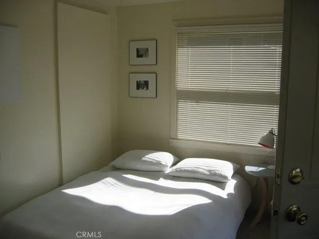 an aerial view of multiple houses with a yard
