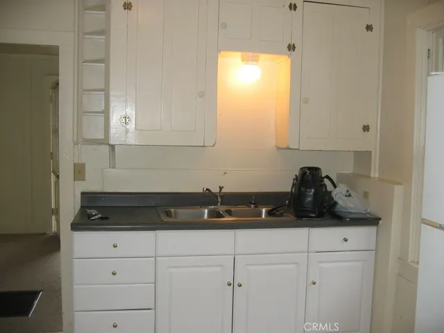 a close view of sink and cabinets