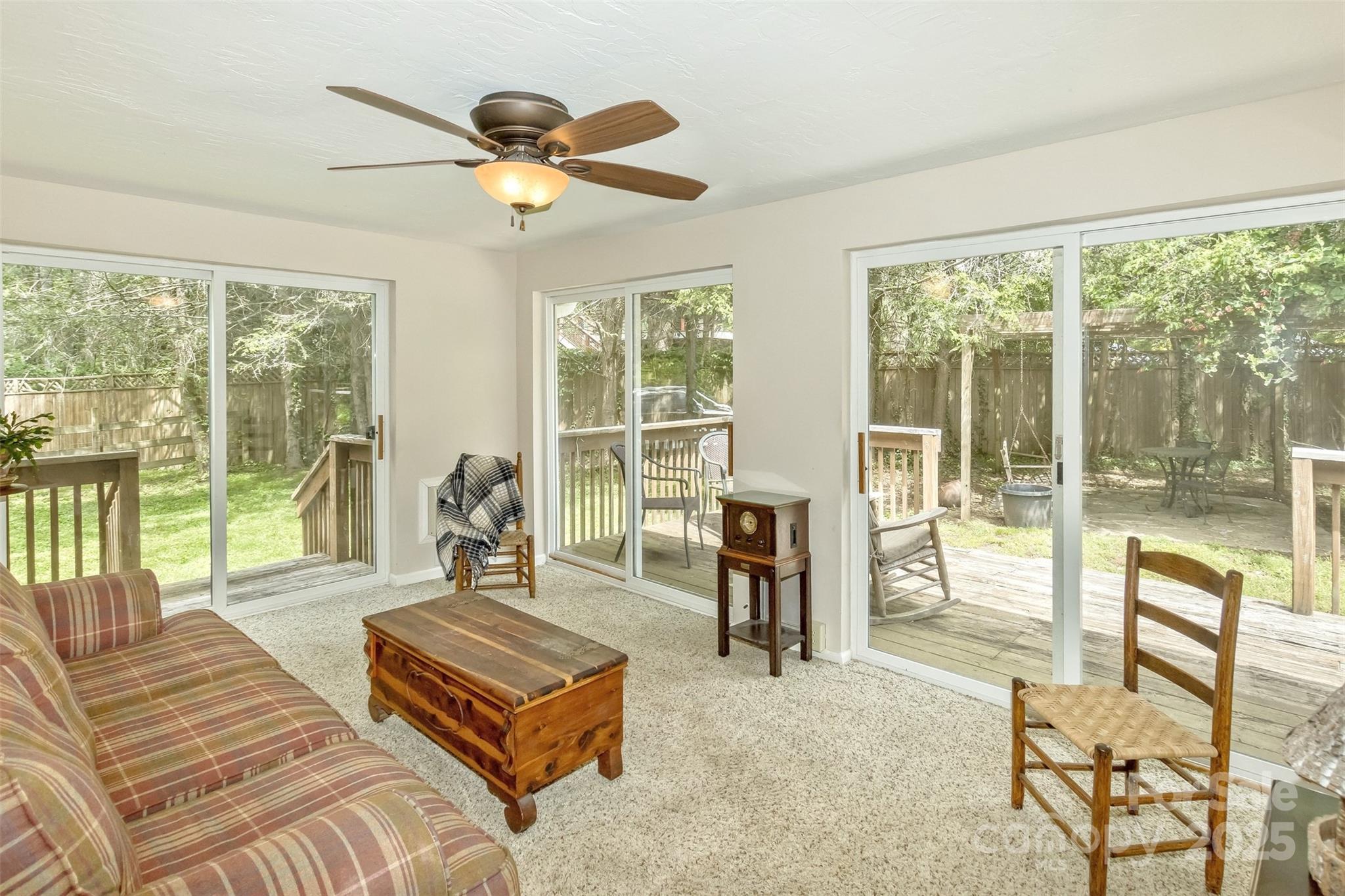 15 Beaverdam Knoll Road Asheville, NC 28804 - Photo 13 of 39 a living room with furniture and a large window with balcony view