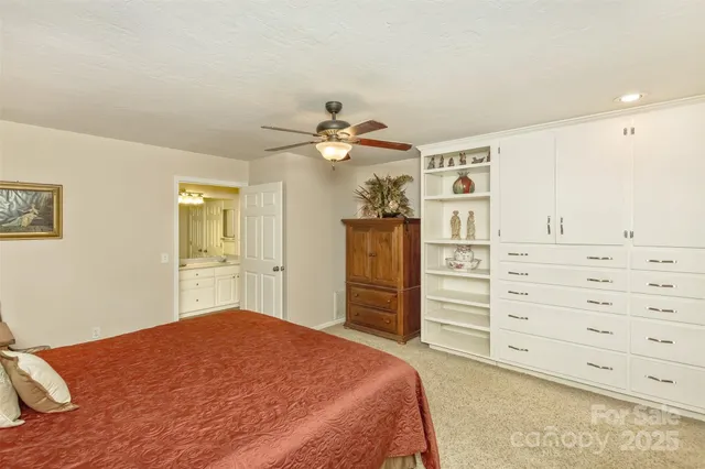 a bedroom with a bed and a cabinets