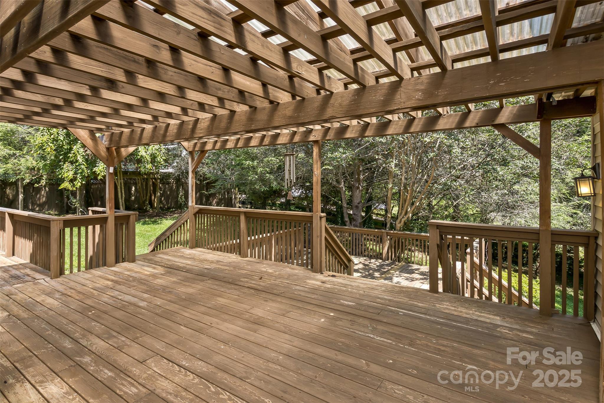 15 Beaverdam Knoll Road Asheville, NC 28804 - Photo 35 of 39 a view of roof deck with wooden floor and seating space