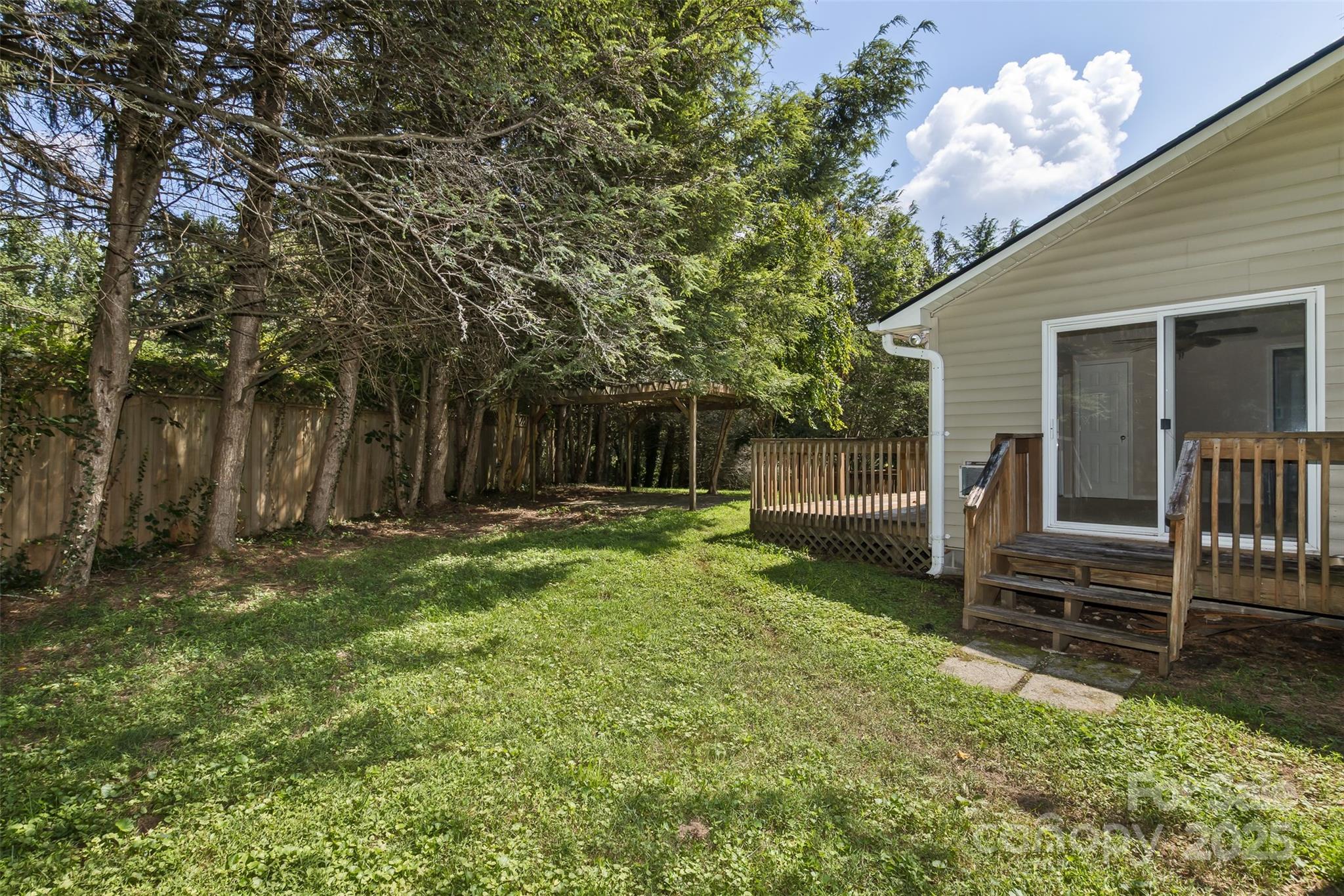 15 Beaverdam Knoll Road Asheville, NC 28804 - Photo 38 of 39 a backyard of a house with barbeque oven