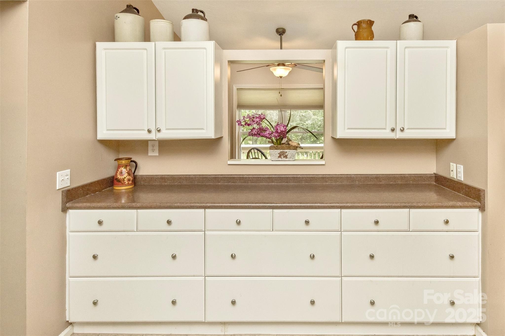 15 Beaverdam Knoll Road Asheville, NC 28804 - Photo 9 of 39 a sink with white cabinets