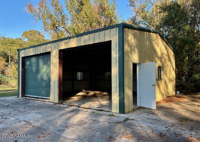 3525 Verot School Road Youngsville, LA 70592 - Photo 33 of 37 Shop with a door open