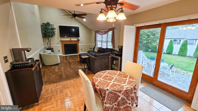 a living room with furniture fireplace and a flat screen tv