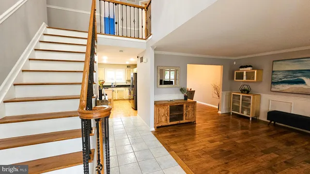 a view of front door with entryway and livingroom