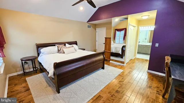 a bed room with a bed and a chair