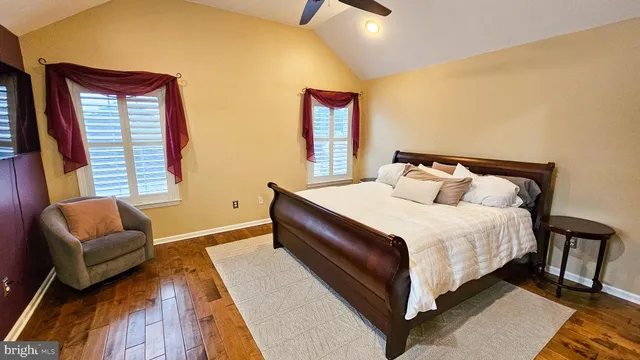 a bedroom with a bed and a couch