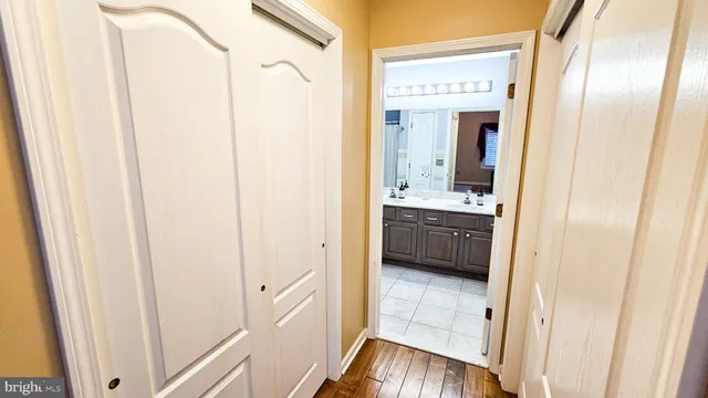 a en suite bathroom with a sink a mirror and a shower