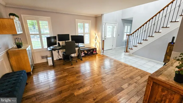 a view of a livingroom with furniture hardwood floor and a windows