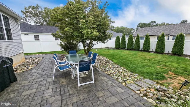a view of a chairs and table in the patio