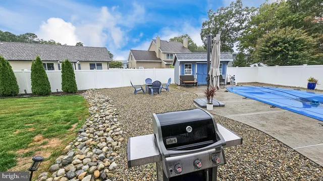 a view of a backyard with furniture