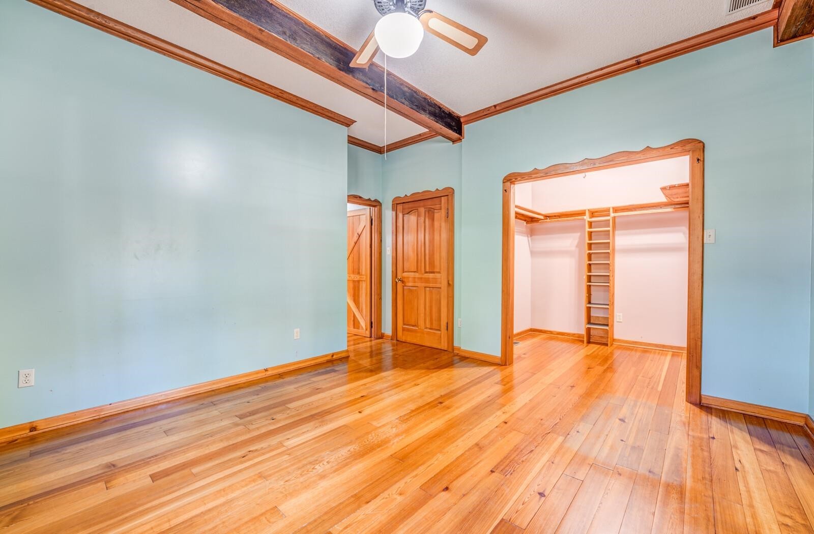 4626 Billy Maher Road Memphis, TN 38135 - Photo 19 of 35 a view of an empty room with wooden floor and a window