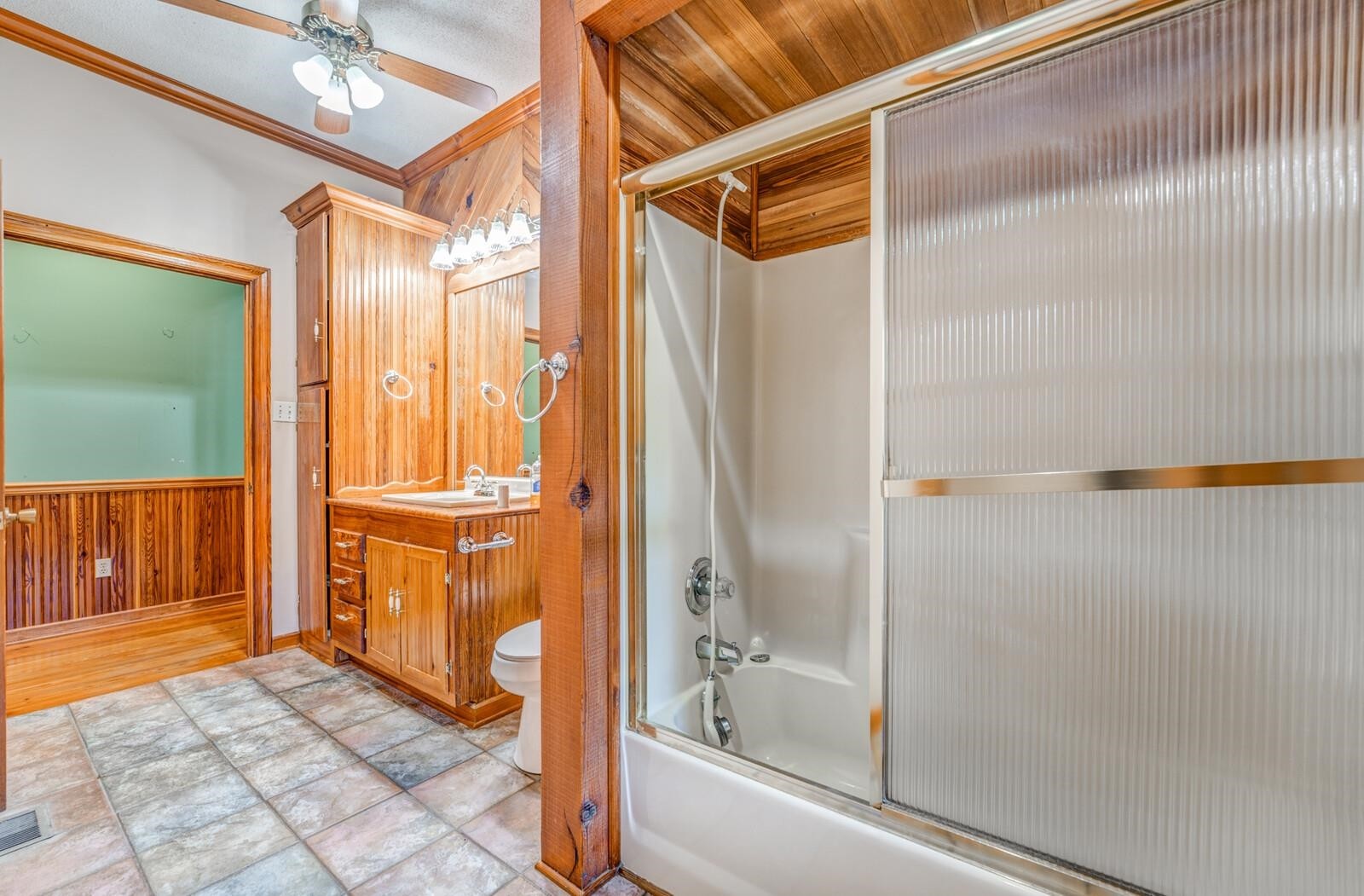 4626 Billy Maher Road Memphis, TN 38135 - Photo 25 of 35 a bathroom with a shower and a glass door shower