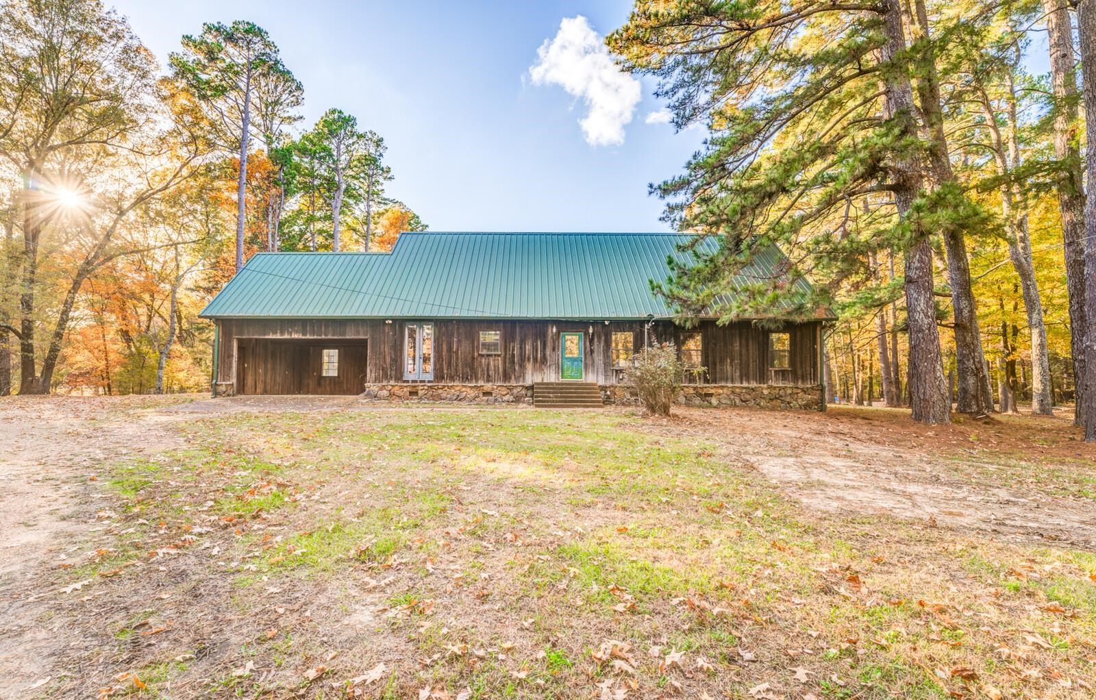 4626 Billy Maher Road Memphis, TN 38135 - Photo 4 of 35 a front view of a house with a yard and trees