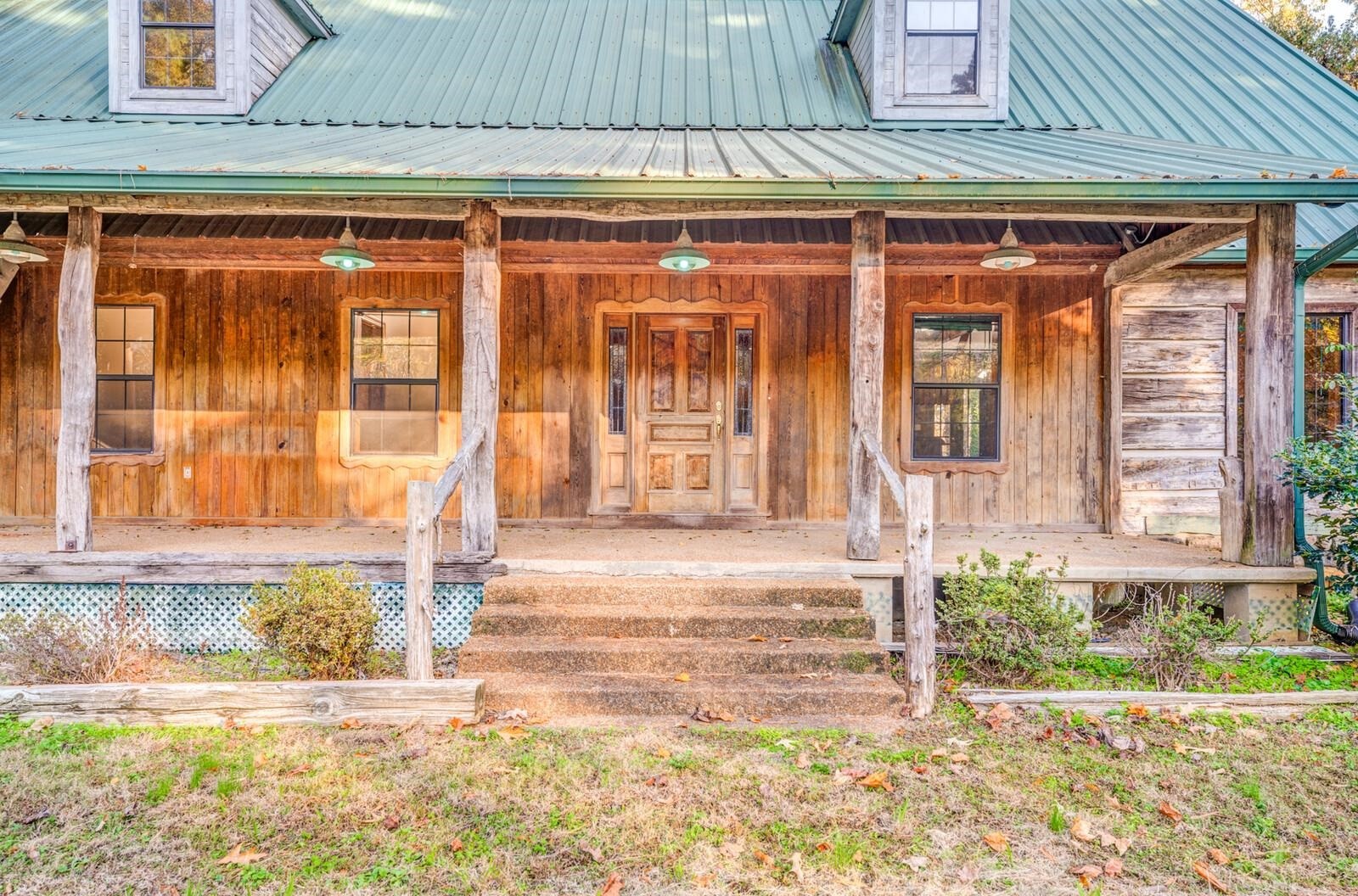 4626 Billy Maher Road Memphis, TN 38135 - Photo 5 of 35 a front view of a house with a yard outdoor seating and garage