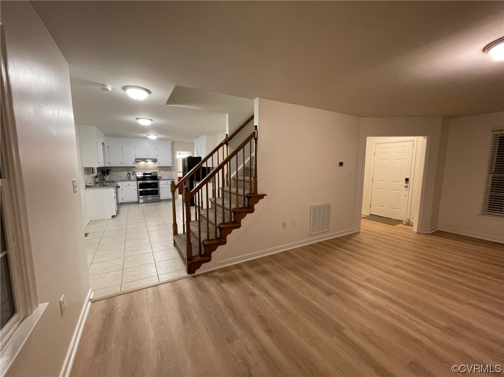 8130 Preakness Court Midlothian, VA 23112 - Photo 12 of 29 a view of a hallway with wooden floor