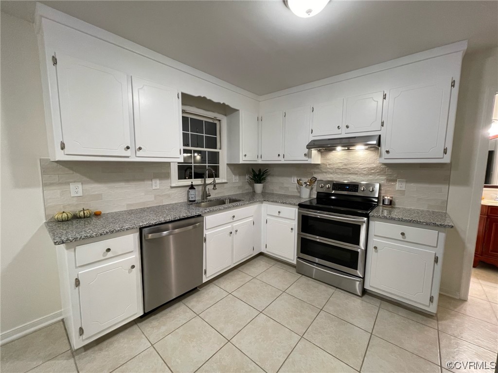 8130 Preakness Court Midlothian, VA 23112 - Photo 14 of 29 a kitchen with granite countertop white cabinets and appliances