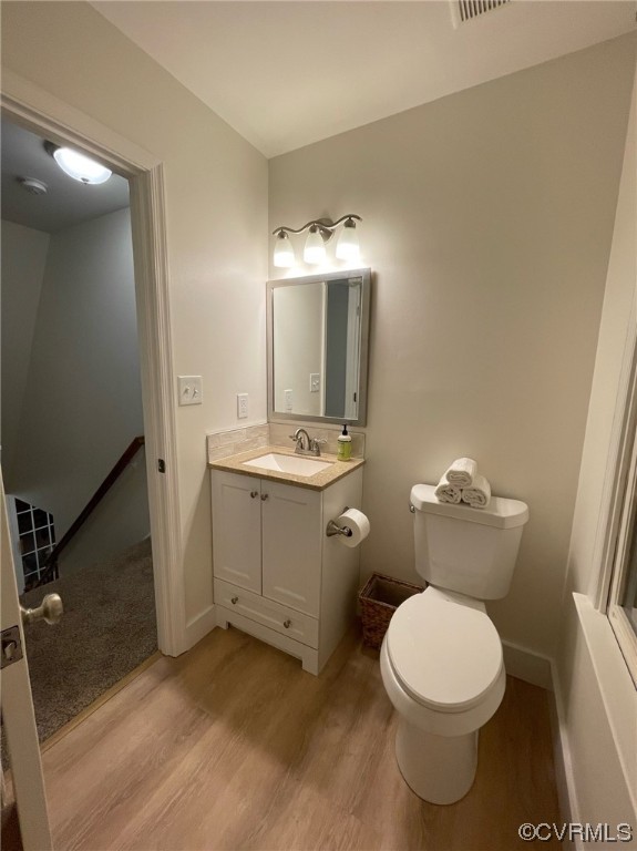 8130 Preakness Court Midlothian, VA 23112 - Photo 19 of 29 a bathroom with a toilet sink and mirror