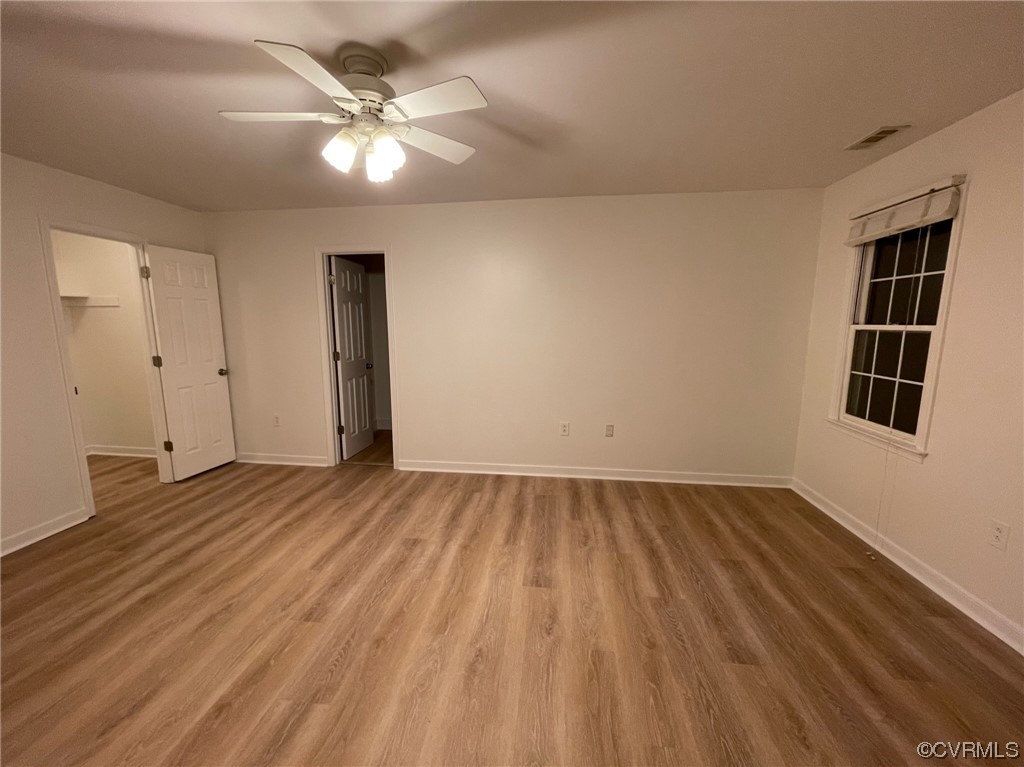 8130 Preakness Court Midlothian, VA 23112 - Photo 24 of 29 wooden floor in an empty room with a window