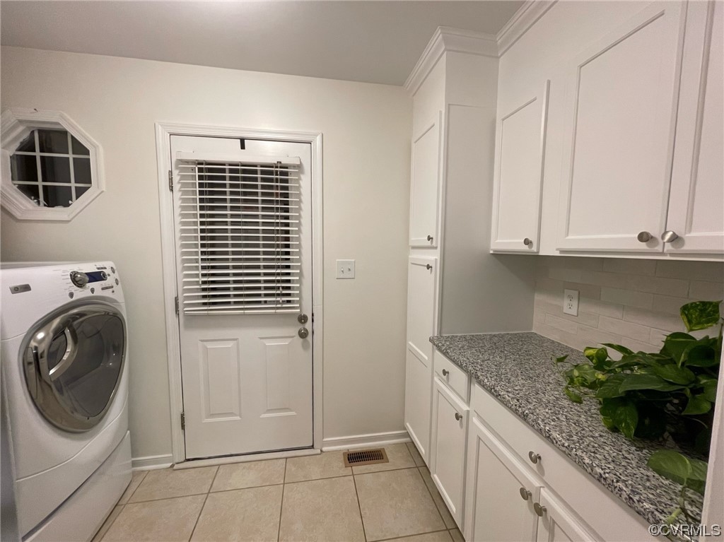 8130 Preakness Court Midlothian, VA 23112 - Photo 29 of 29 a utility room with granite countertop a sink a washer and dryer