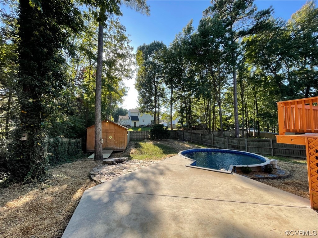 8130 Preakness Court Midlothian, VA 23112 - Photo 6 of 29 a view of backyard with swimming pool and seating space