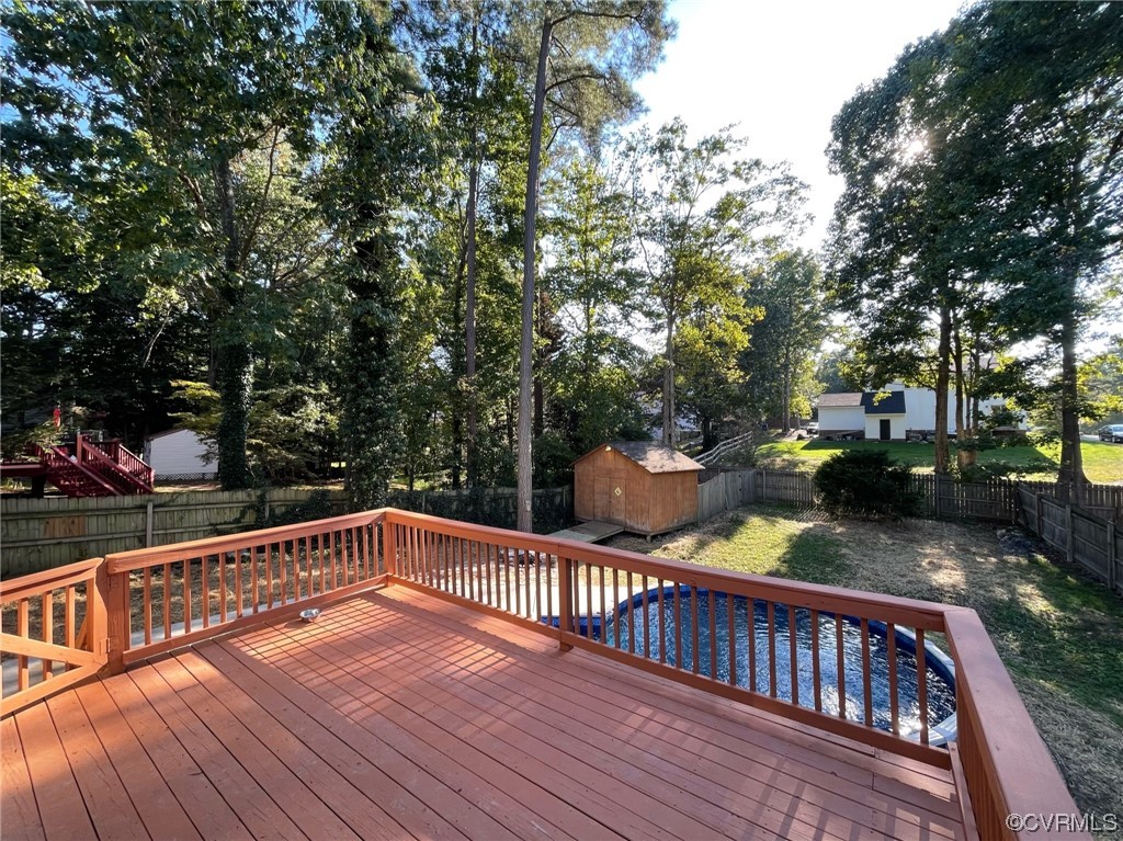 8130 Preakness Court Midlothian, VA 23112 - Photo 8 of 29 a view of deck with trees and wooden fence