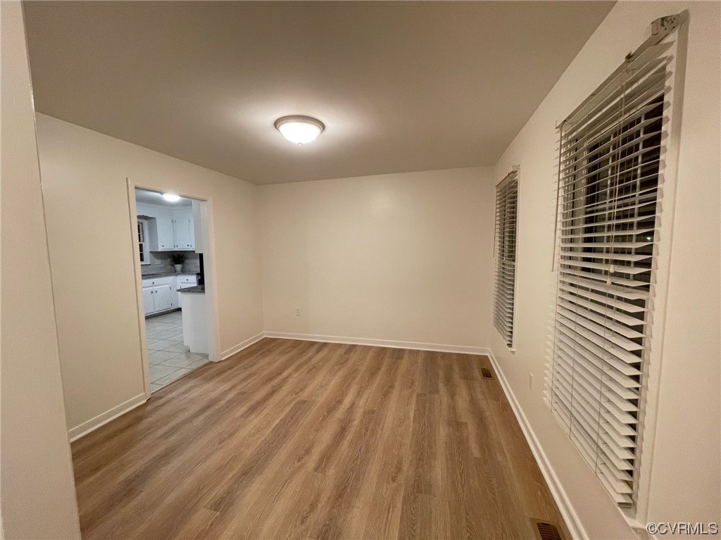 8130 Preakness Court Midlothian, VA 23112 - Photo 10 of 29 wooden floor in a room next to a window