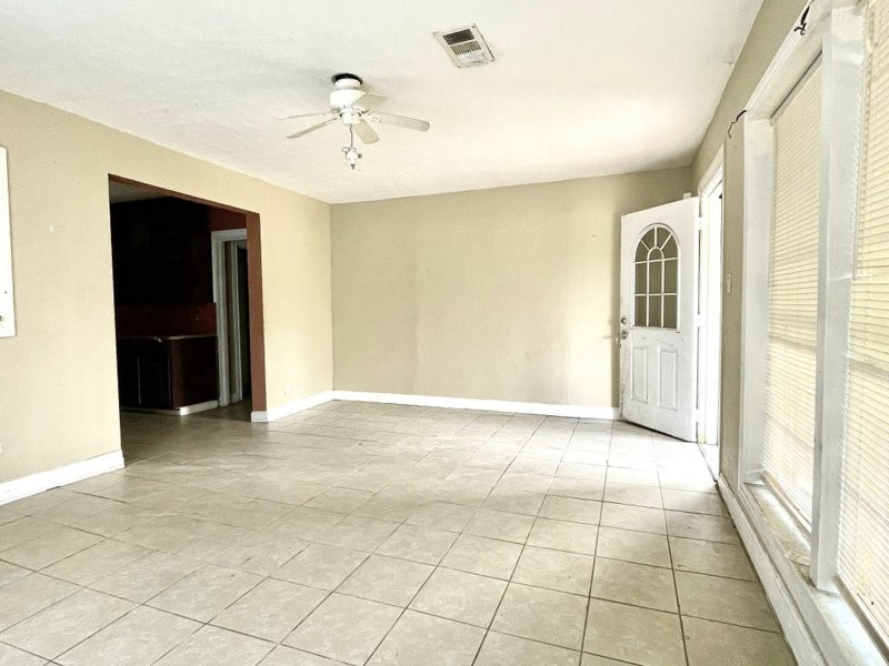 2814 Elysian Street Houston, TX 77009 - Photo 5 of 10 a view of an empty room with cabinet and a window