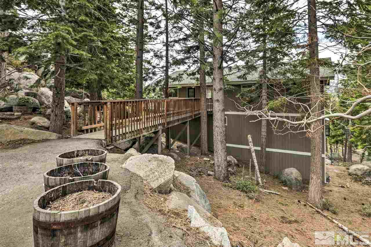 a backyard of a house with barbeque oven