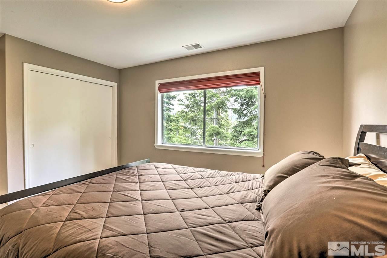 321 Barton Drive Stateline, NV 89449 - Photo 11 of 23 a bedroom with a bed and a window
