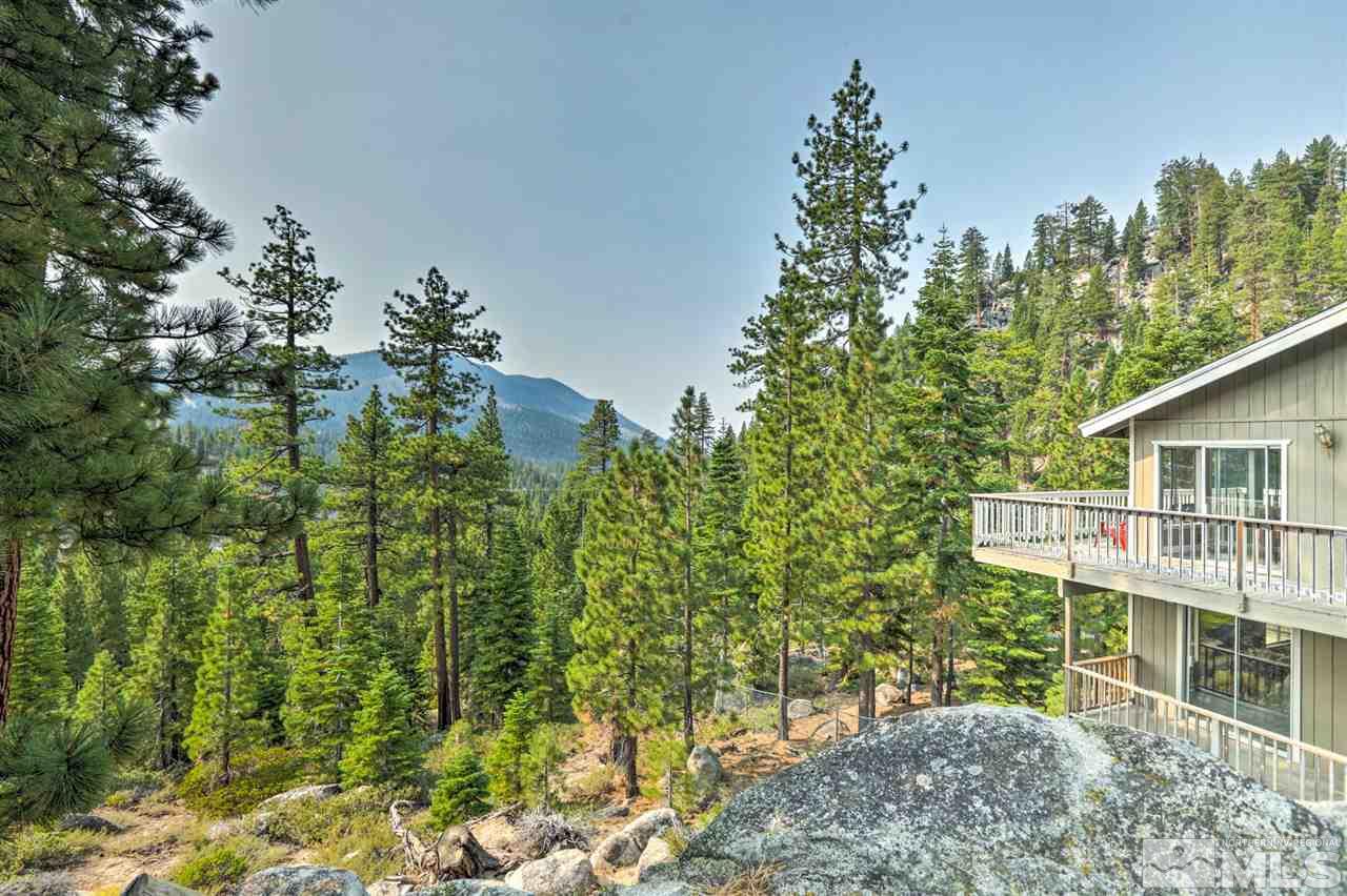 321 Barton Drive Stateline, NV 89449 - Photo 15 of 23 view of house with trees in the background